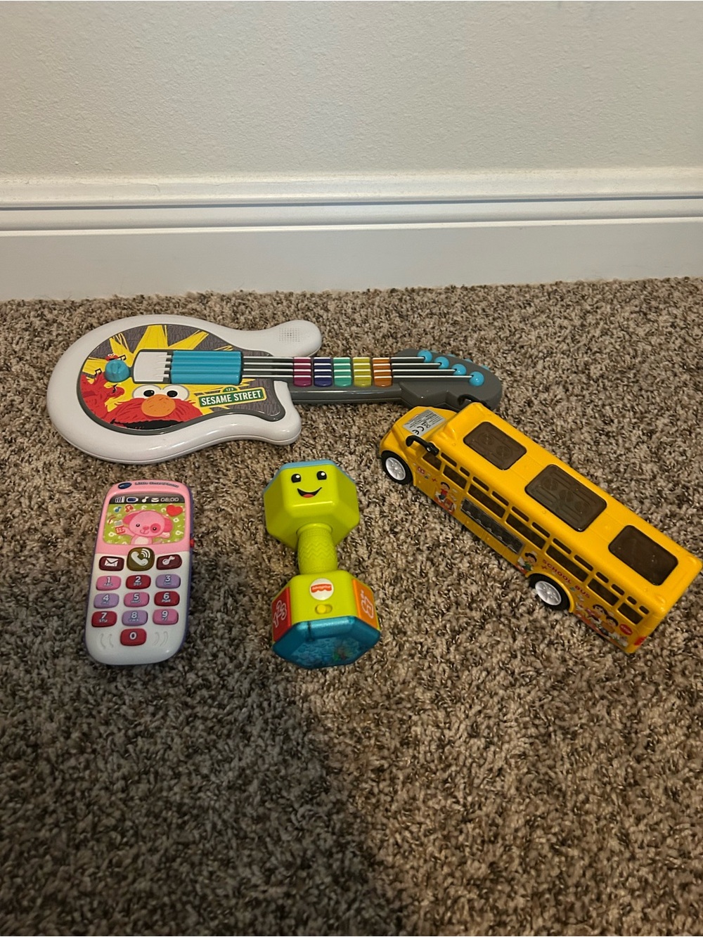 4 Assorted Kids Toys - Elmo guitar, tech phone, fisher price weight, music bus